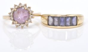 A 9ct gold hallmarked cluster ring. The ring with central round facet cut purple stone within a halo