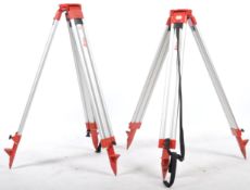 A set of 2 Leica 20th century wooden and cast metal surveyors tripod stands. Each with tapering legs