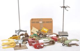 A mid century Industrial laboratory equipment clamp stand having upright pole with metal clamp clasp