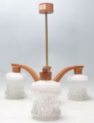 A retro mid century teak wood and glass 3 branch chandelier / electrolier. The chandelier with
