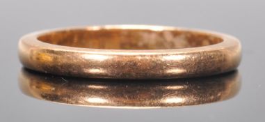 A hallmarked 22ct gold band ring of simple form. Hallmarked Birmingham 1984. Weight 3.3g. Size J.5.