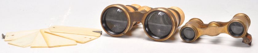 A 19th century Ivory aide de memoir notebook pad together with a set of opera glasses having faux