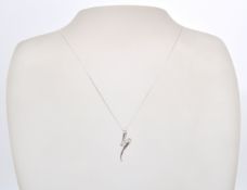 A 9ct white gold necklace chain and pendant. The white gold pendant of scroll form set with