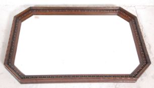 An Edwardian early 20th century large Jacobean revival  antique carvec oak cushion framed wall