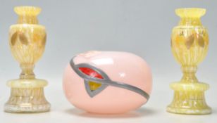 A vintage Art Deco pottery having a bulbous form having hand painted floral decoration together with