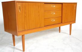 A vintage retro 20th Century teak veneered sideboard credenza having a central bank of four