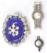 A collection of vintage silver and enamel set clasps to include Victorian single stone, larger