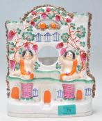 A 19th Century Victorian Staffordshire ceramic clo