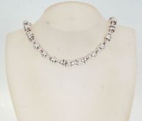 A Links Of London style silver necklace having rou