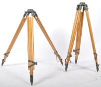 2 RETRO 20TH CENTURY WOODEN AND CAST METAL SURVEYORS TRIPODS