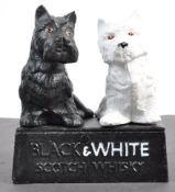 CAST IRON BUCHANAN'S BLACK AND WHITE SCOTCH WHISKY ORNAMENT