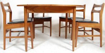A vintage retro 20th century teak wood circular extending dining table with four chairs, having