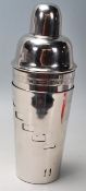 A large silver plated cocktail shaker of tapering form with a rotating outer vessel. The inner