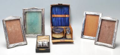 A collection of early 20th Century hallmarked sterling silver items to include four sterling