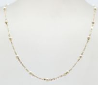 A ladies vintage 9ct gold and pearl necklace chain having a spring ring clasp. Unmarked but tests as