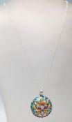 A stamped .925 silver pendant necklace having plique a jour decoration in the form of a cat on a