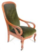 A Victorian 19th Century button back arm chair / library chair upholstered in green velour button