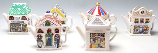 A collection of six 20th century retro teapots made by Wade being modelled in a vintage and