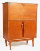 A retro vintage mid 20th century teak wood Danish manner drinks / cocktail cabinet of two tiered