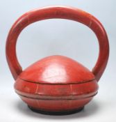 A 20th Century Chinese wooden box of round domed form having a large carved wooden domed handle to