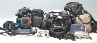 A collection of vintage retro camera equipment to include a Pentax P30, Lumix FZ38, SMC PENTAX- A