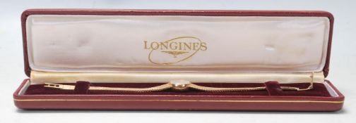 A vintage late 20th Century 18ct gold ladies Longines cocktail wrist watch having a round face