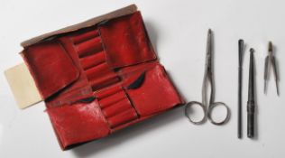 A collection of antique early 20th Century medical instruments, two of which marked Evans,