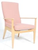 A vintage mid century Parker Knoll  armchair. The chair with square tapering legs and shaped elbow