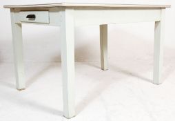 A mid century 1950s vintage country pine refectory dining table. The table having a blue formica top