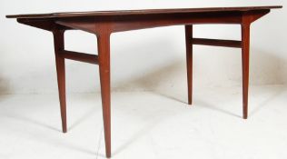 A 1970's retro teak wood Youngers dining table of rectangular form having tapering legs with