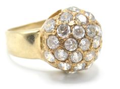 A stamped 375 9ct gold ring having a spherical head being set with round cut white stones. Weight