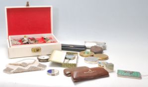 A collection of various 20th Century items to include ladies compacts with decoration at the top,