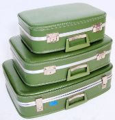 A good set of vintage retro 1960's graduating set of  suitcases finished in green with an