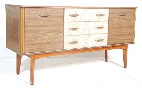 A retro vintage mid century, circa 1950's melamine credenza sideboard having a central bank of three