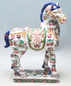 A 20th Century Chinese oriental Tang horse statue in the manner of Tang Dynasty with famille verte