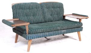 A vintage retro Danish Influenced 1970's sofa bed / settee having a wooden frame with rail