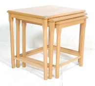 A set of three retro vintage  20th century graduated light oak / blonde oak nest of tables. Each