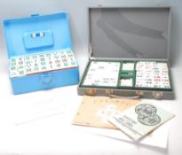 Two mid 20th Century Oriental Mahjong set, one set having plastic pieces with clear flower