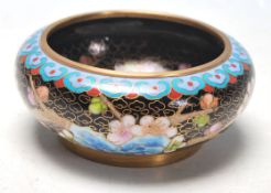 A 20th Century Chinese Cloisonne dish of round from having enamelled decoration throughout depicting