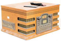 A vintage retro wooden effect Hi Fi stereo system by Steepletone with a black grill and facia.