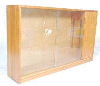 A vintage retro mid 20th Century low library bookcase  cabinet  in the manner of Herbert Gibbs