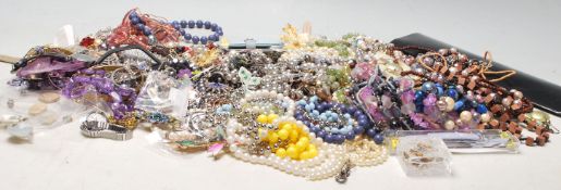 A large collection of Costume jewellery to include bracelets, rings, necklaces, brooches, scarf