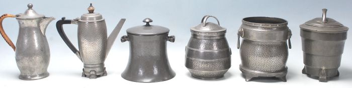 A good collection of hand beaten Liberty style Art and Crafts pewter items to include three tea