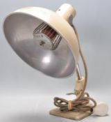 A retro vintage Industrial mid 20th century, circa 1960's Pifco infrared heat lamp coloured in beige