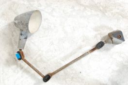 An early 20th century Industrial factory workshop anglepoise lamp with adjustable metal pole and