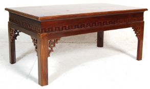 A 20th Century antique Chinese Opium style low coffee table of rectangular shape raised on four