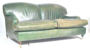 A good 20th century Howards of London type green full grain leather 2 seat sofa settee being