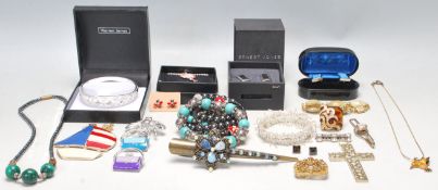 A collection of vintage costume jewellery to include two pairs of boxed gentleman's cufflinks, an