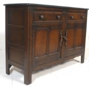 An 20th Century vintage oak Ercol bookcase dresser having a flared top with a three tiered open