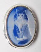 A 20th Century Sterling Silver brooch of oval form inset with a carved stone depicting a long haired